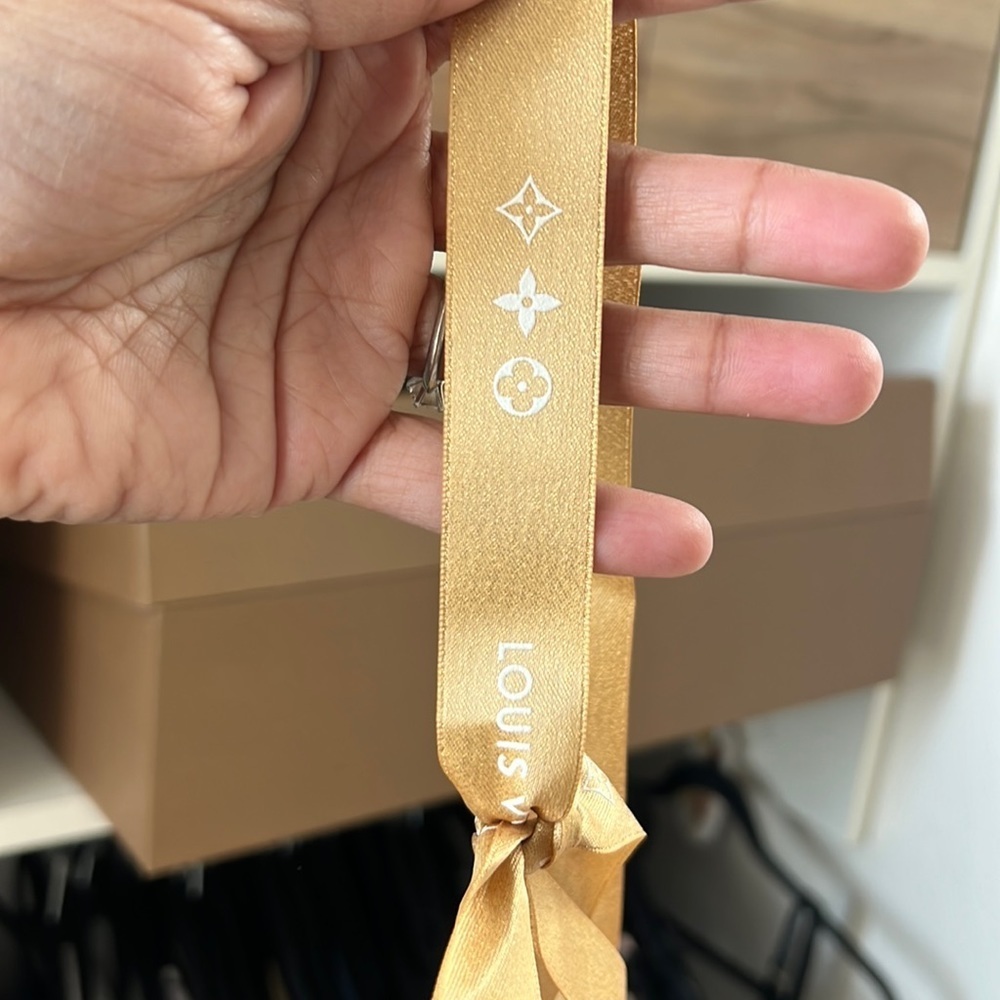 Louis Vuitton gold ribbon